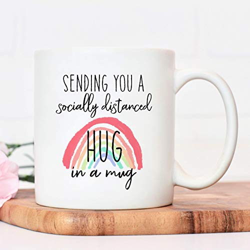 Socially distanced hug in mug coffee cup